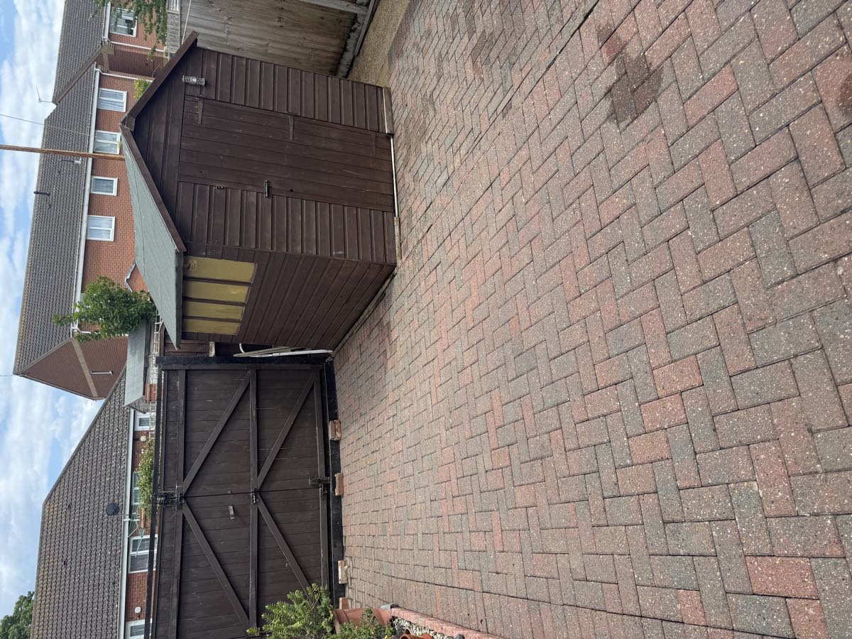 Red block-paved driveway restored with pressure washing